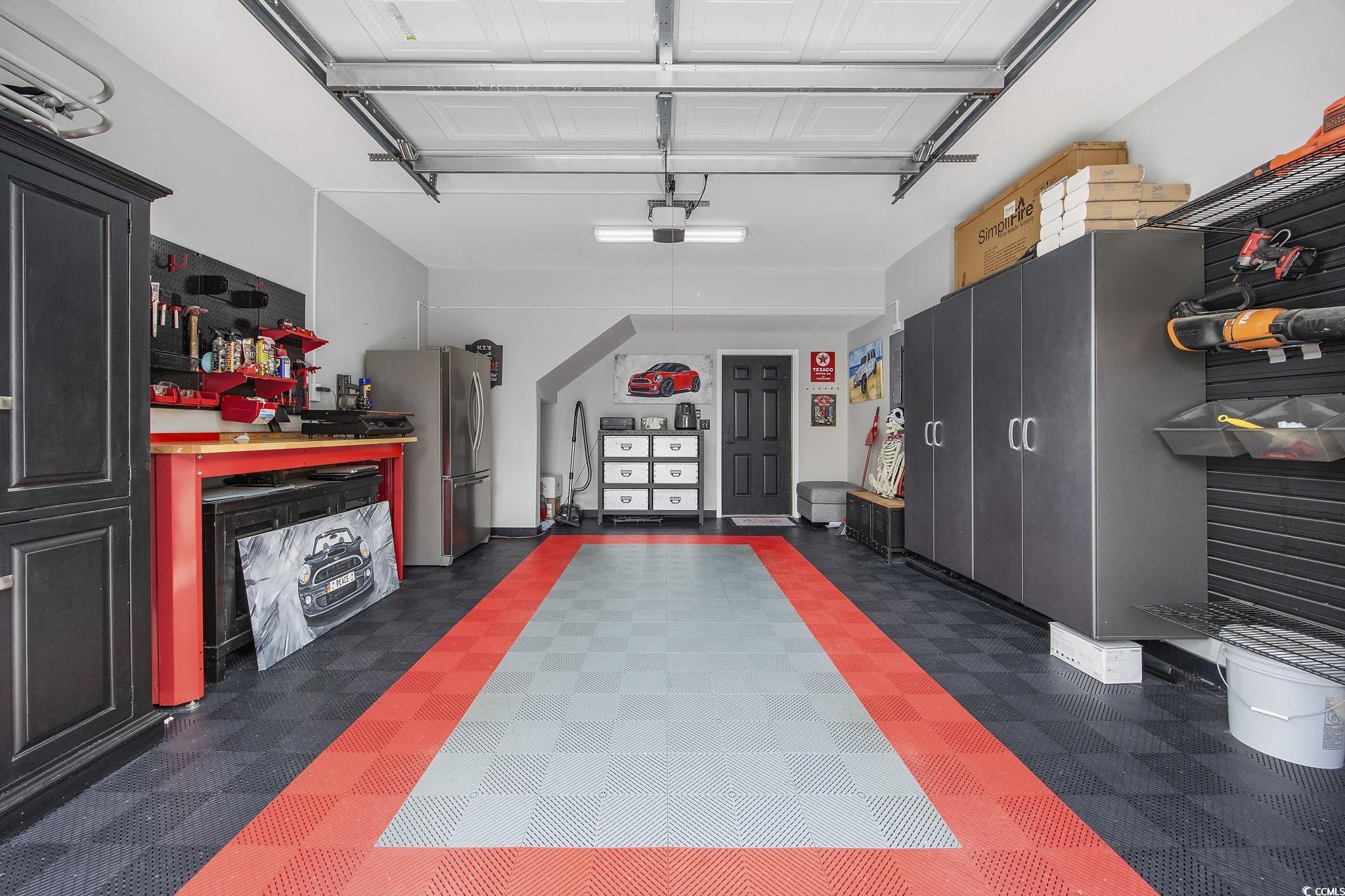 751 Murray Avenue, Unit 751 Myrtle Beach, SC 29577 - Photo 25 of 34 Garage with stainless steel fridge and a workshop