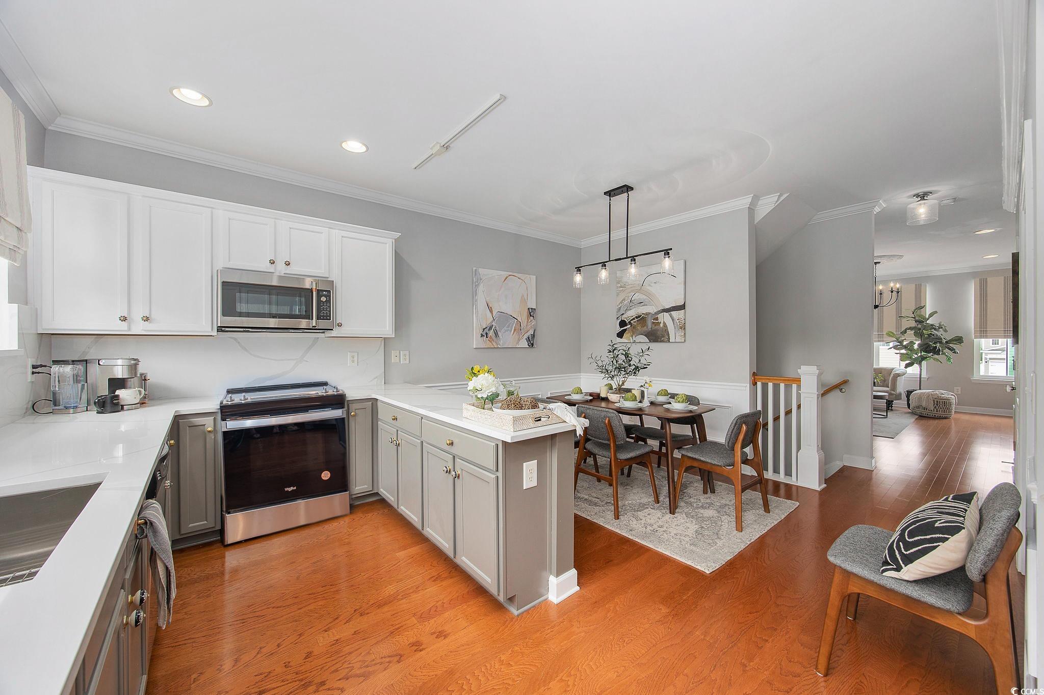 751 Murray Avenue, Unit 751 Myrtle Beach, SC 29577 - Photo 8 of 34 Kitchen featuring kitchen peninsula, hanging light