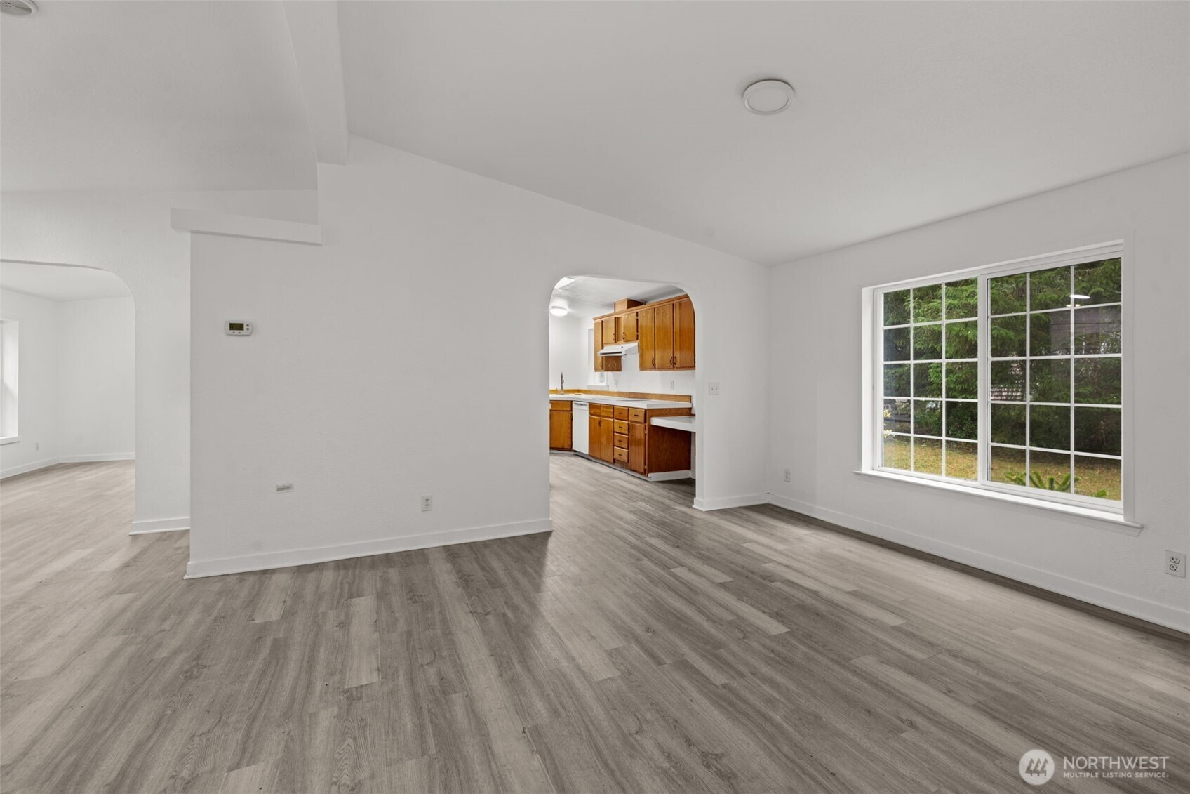 35952 Stackpole Road Ocean Park, WA 98640 - Photo 11 of 40 wooden floor in an empty room with a window