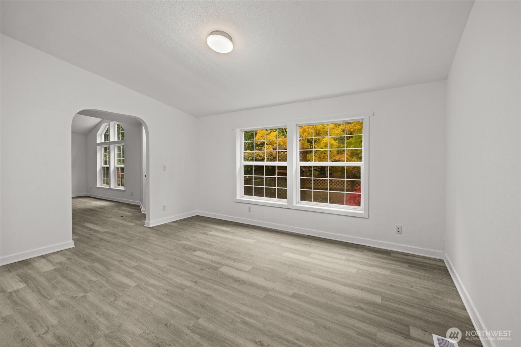 35952 Stackpole Road Ocean Park, WA 98640 - Photo 13 of 40 a view of an empty room with wooden floor and a window