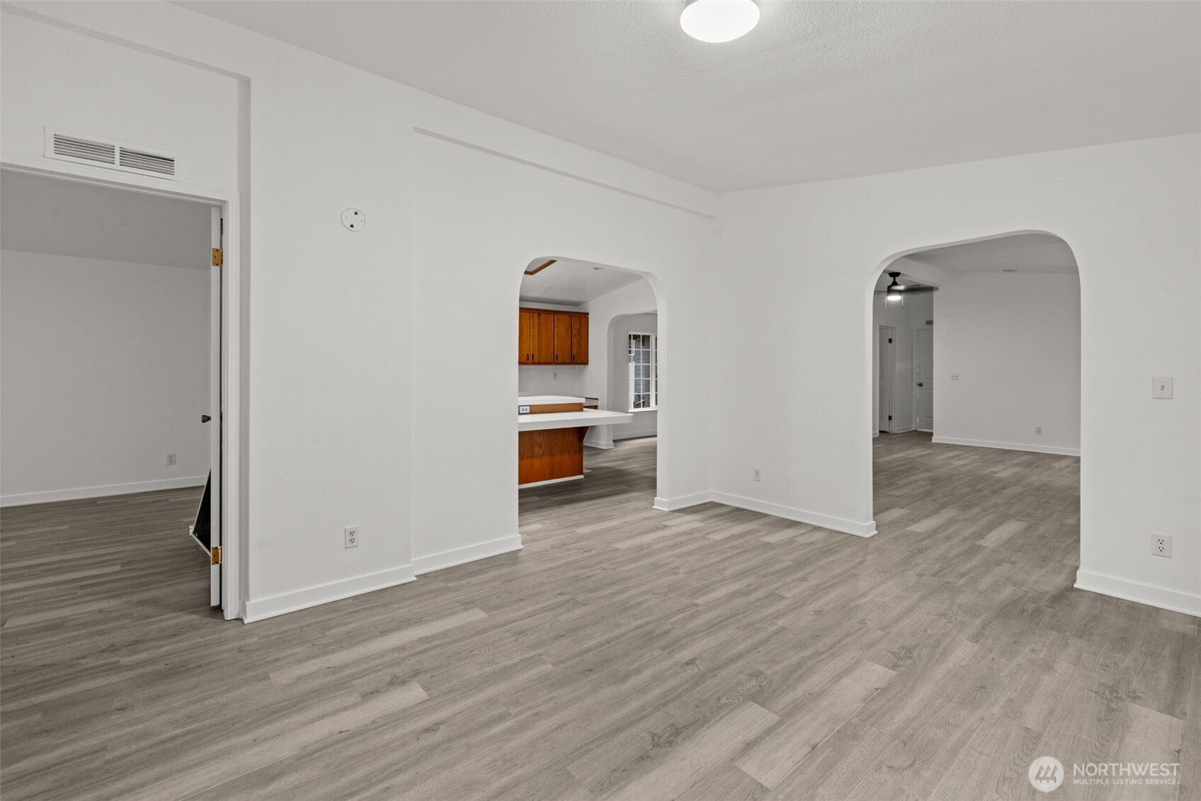 35952 Stackpole Road Ocean Park, WA 98640 - Photo 14 of 40 an empty room with wooden floor and windows