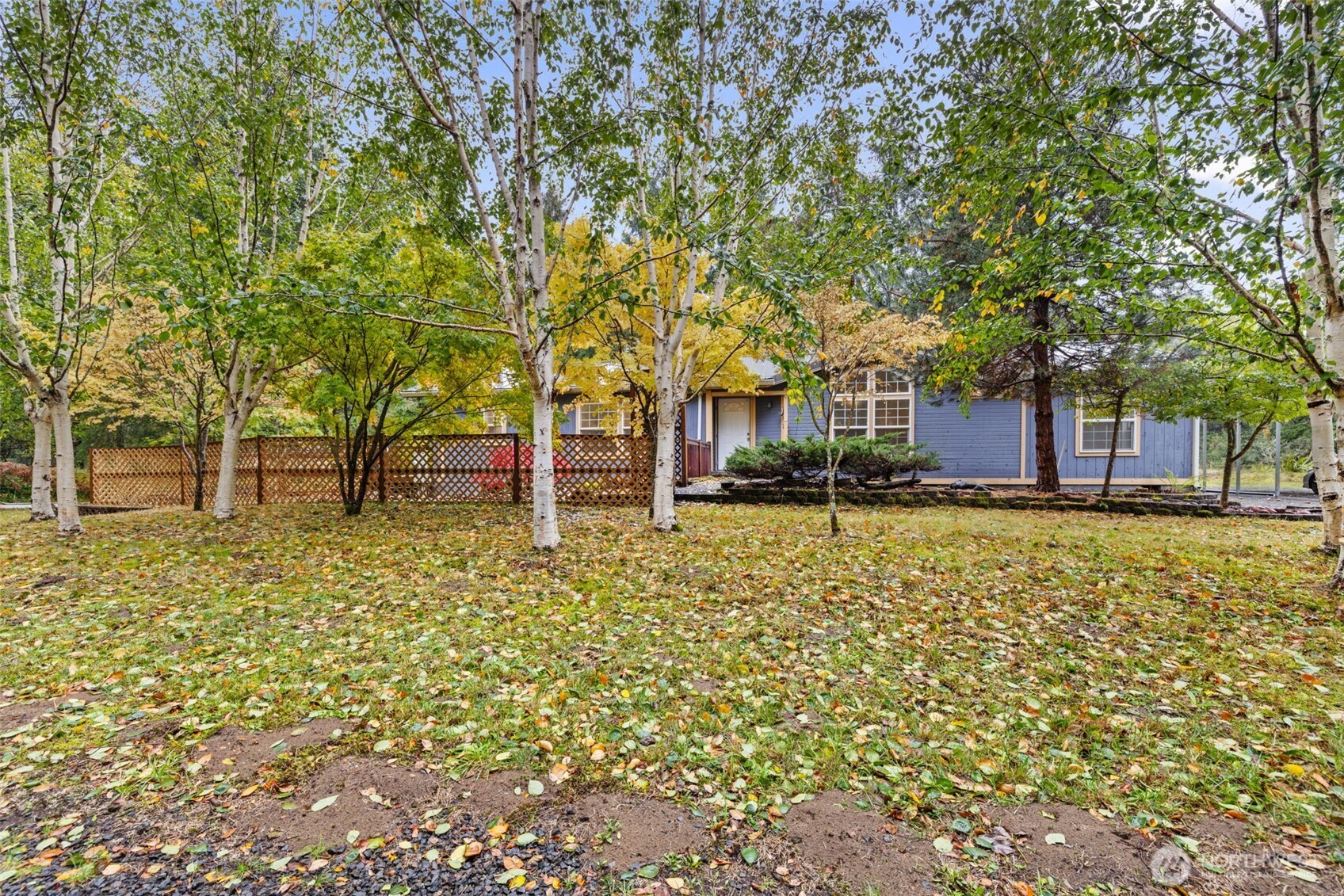 35952 Stackpole Road Ocean Park, WA 98640 - Photo 2 of 40 a front view of a house with a yard