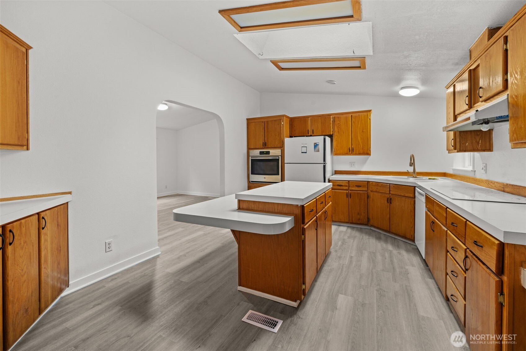 35952 Stackpole Road Ocean Park, WA 98640 - Photo 23 of 40 a kitchen with stainless steel appliances granite countertop a sink stove and refrigerator