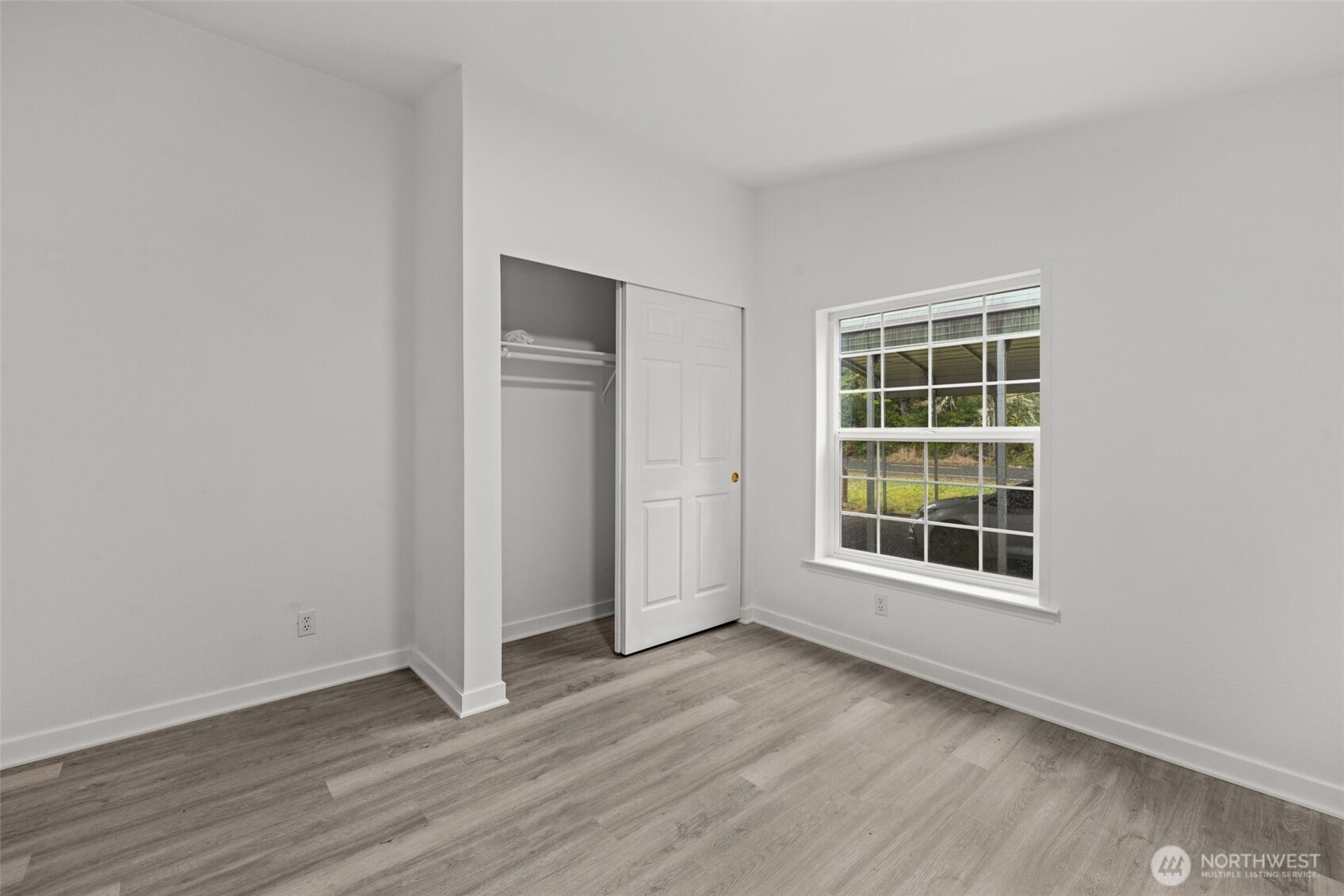 35952 Stackpole Road Ocean Park, WA 98640 - Photo 28 of 40 an empty room with wooden floor and windows