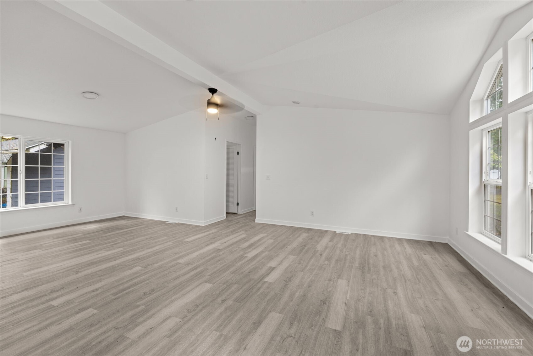 35952 Stackpole Road Ocean Park, WA 98640 - Photo 3 of 40 wooden floor in an empty room with a window
