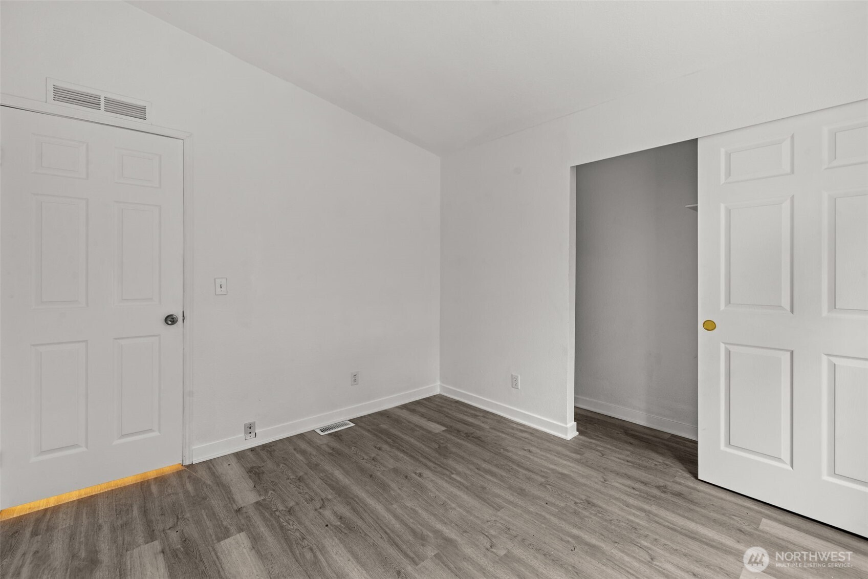 35952 Stackpole Road Ocean Park, WA 98640 - Photo 32 of 40 a view of an empty room with wooden floor