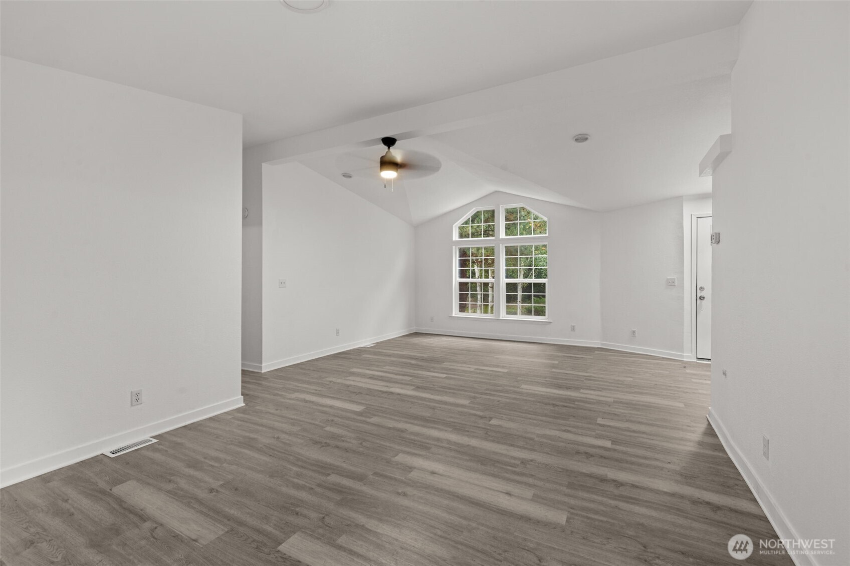 35952 Stackpole Road Ocean Park, WA 98640 - Photo 5 of 40 wooden floor in an empty room with a window