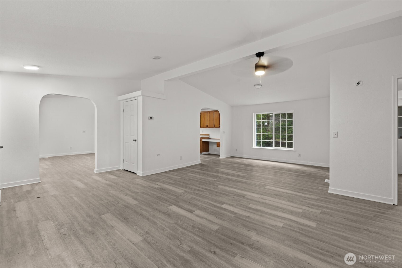 35952 Stackpole Road Ocean Park, WA 98640 - Photo 7 of 40 wooden floor in an empty room with a window