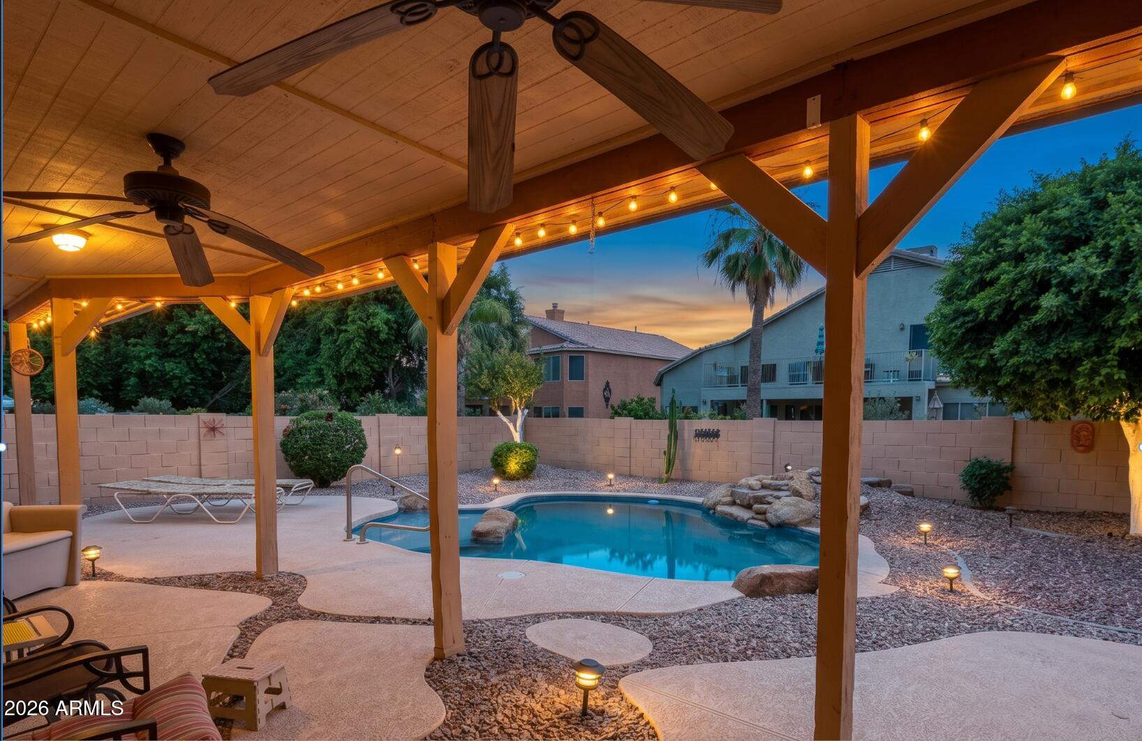 433 West Desert Avenue Gilbert, AZ 85233 - Photo 9 of 23 a view of a patio with table and chairs potted plants