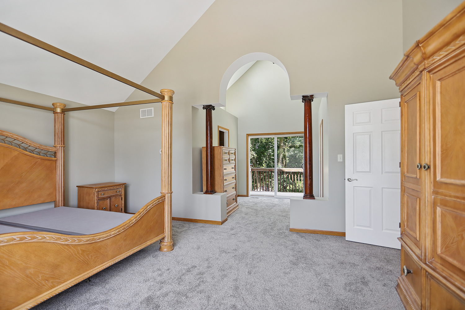 516 Whelan Street Lockport, IL 60441 - Photo 11 of 27 a spacious bedroom with a bed and glass door