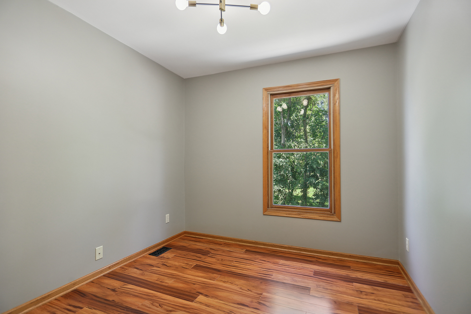 516 Whelan Street Lockport, IL 60441 - Photo 21 of 27 wooden floor in an empty room with a window