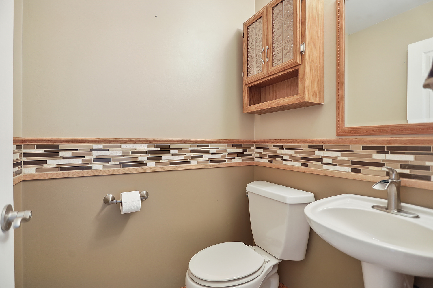 516 Whelan Street Lockport, IL 60441 - Photo 10 of 27 a bathroom with a sink a toilet and mirror
