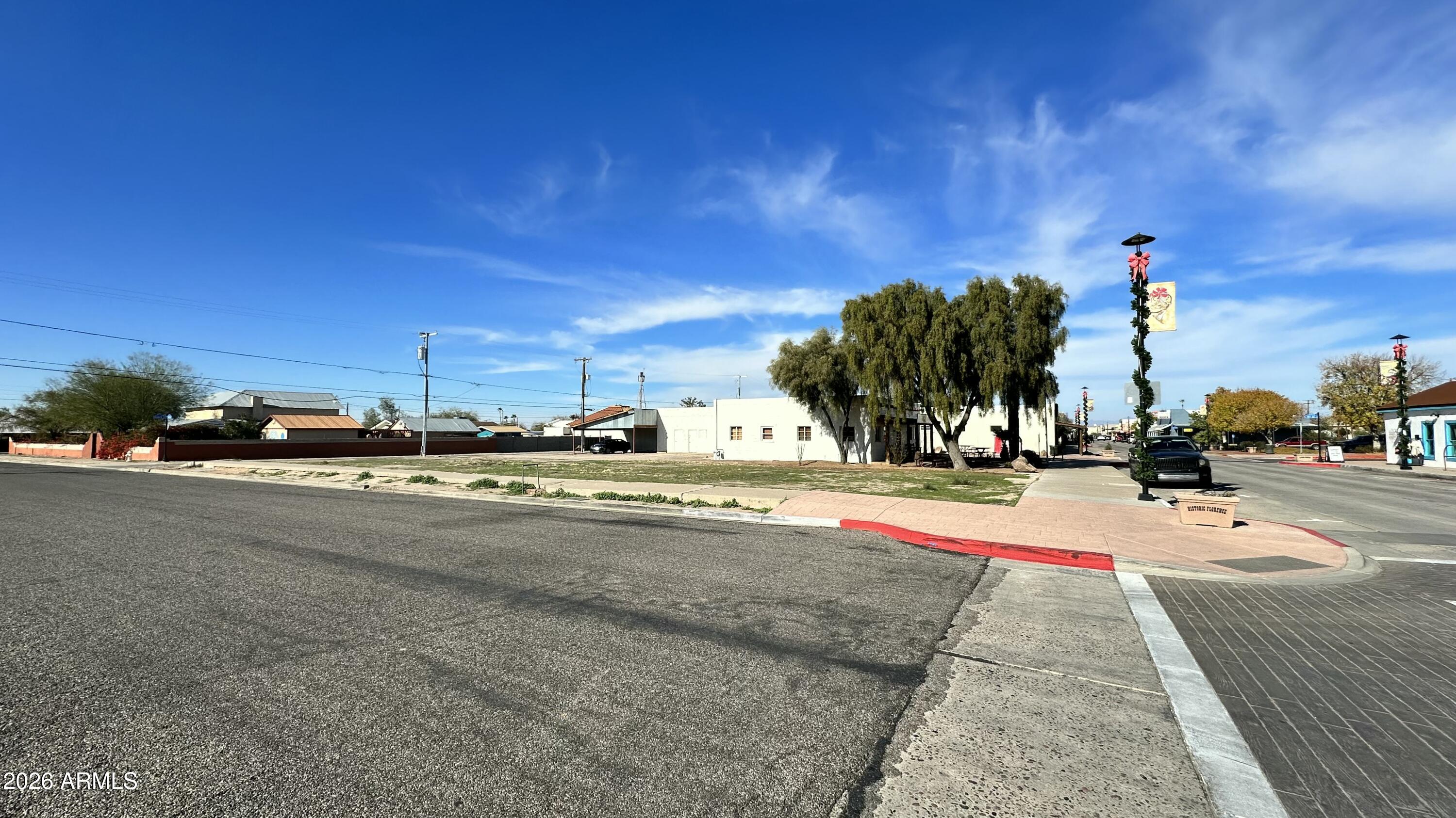 110 North Main Street Florence, AZ 85132 - Photo 2 of 19 a view of a street with houses