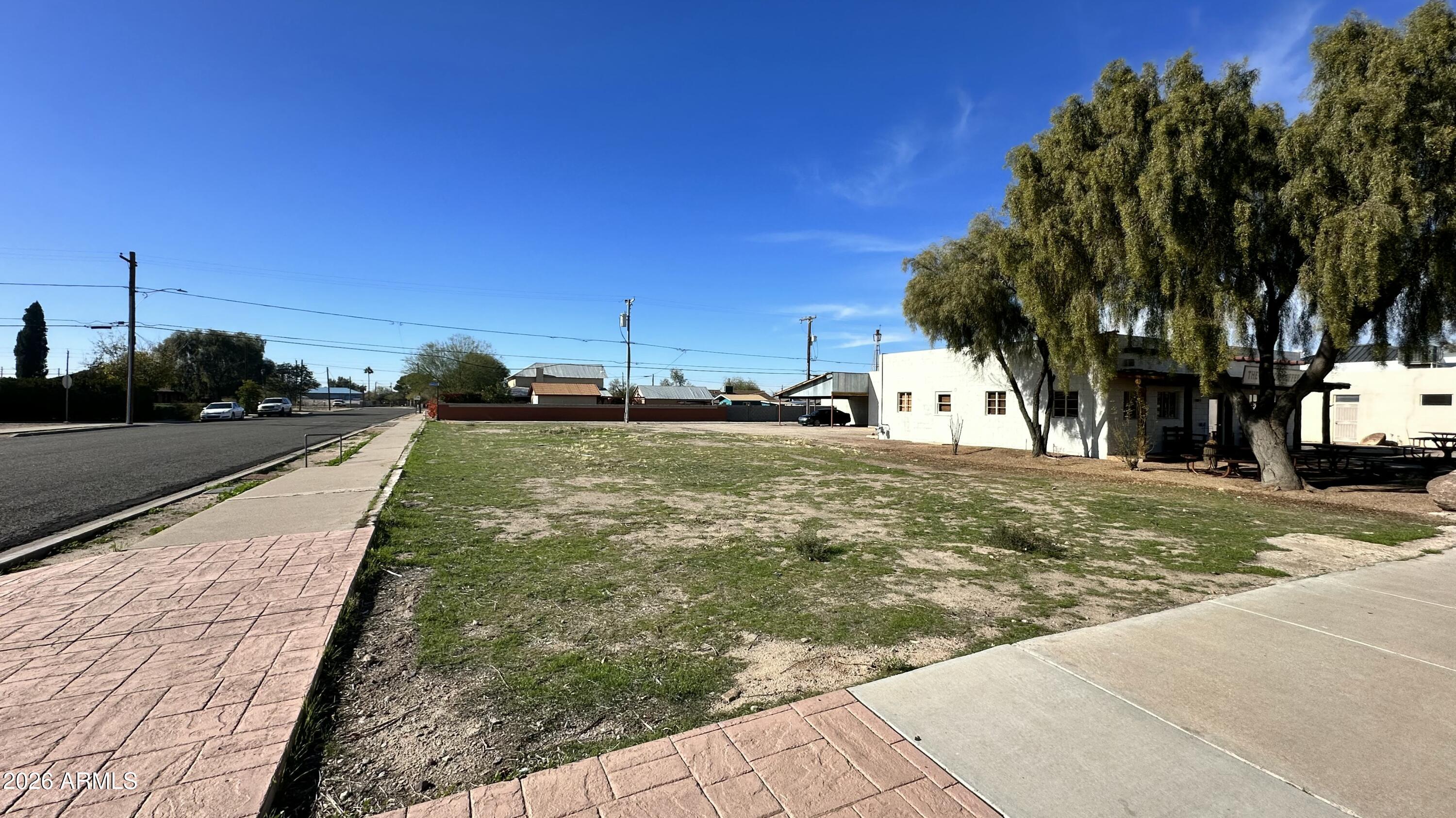 110 North Main Street Florence, AZ 85132 - Photo 3 of 19 a view of a backyard with a garden
