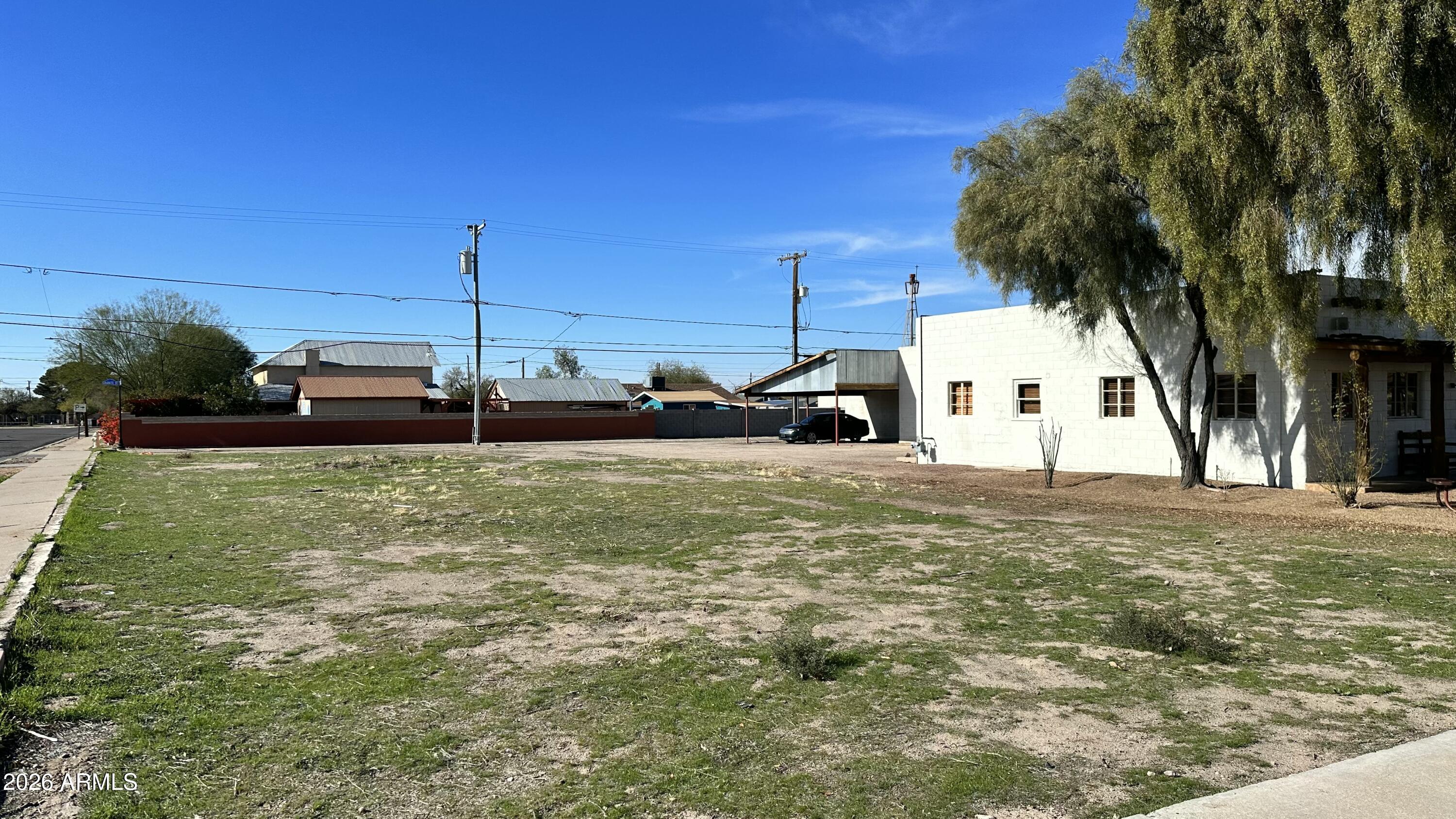 110 North Main Street Florence, AZ 85132 - Photo 4 of 19 a view of a house with a yard