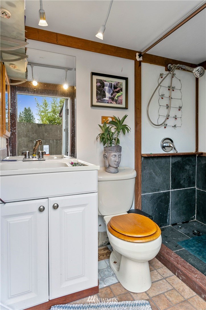 21234 Redmond-Fall City Road Northeast Redmond, WA 98053 - Photo 17 of 18 a bathroom with a toilet a sink and a shower