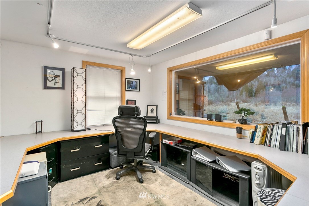 21234 Redmond-Fall City Road Northeast Redmond, WA 98053 - Photo 8 of 18 a view of a workspace with furniture and a window
