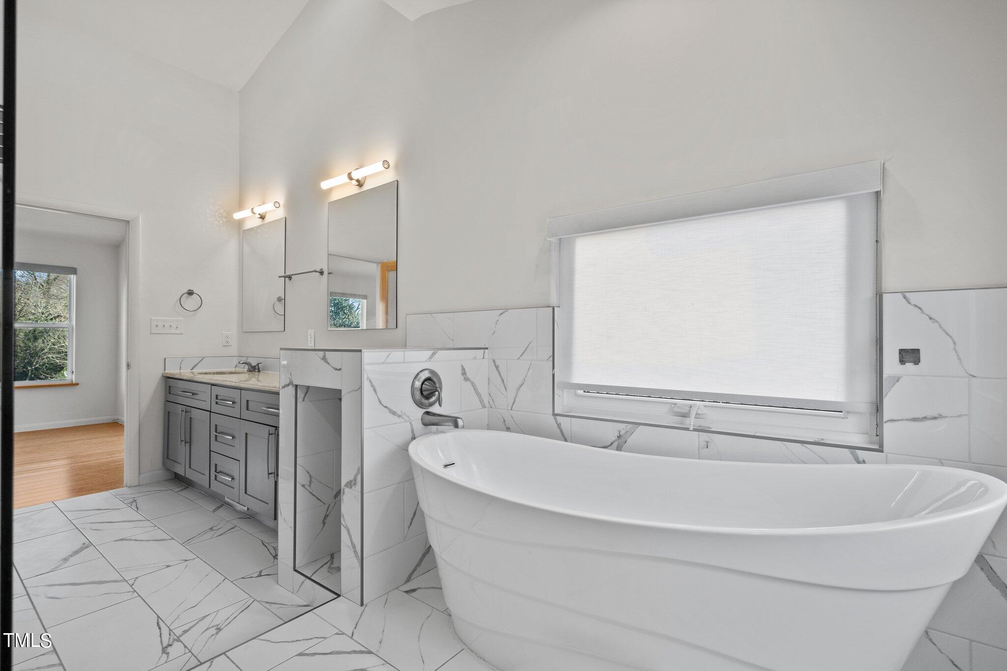 1427 East Lane Street Raleigh, NC 27610 - Photo 21 of 53 a bathroom with a bathtub and a sink
