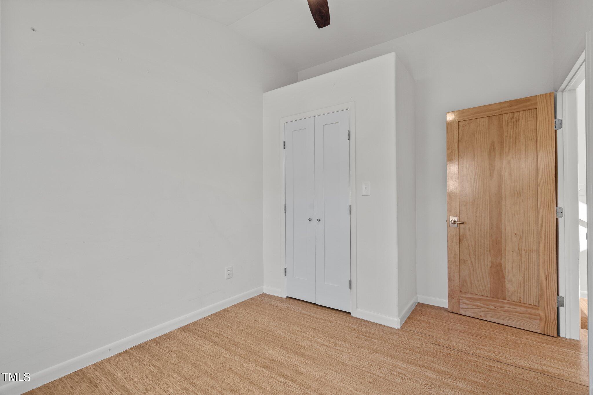 1427 East Lane Street Raleigh, NC 27610 - Photo 26 of 53 a view of an empty room with wooden floor