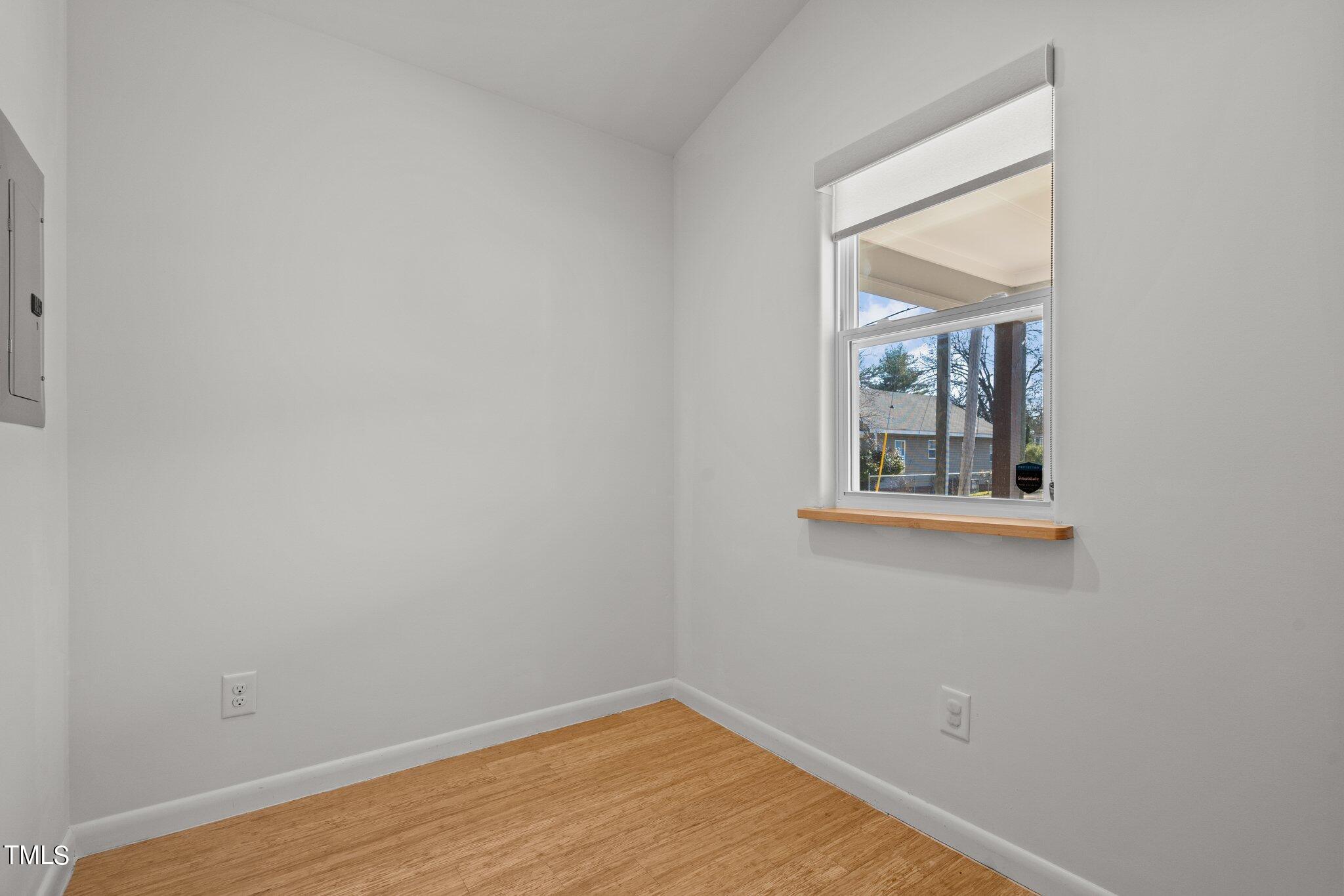 1427 East Lane Street Raleigh, NC 27610 - Photo 29 of 53 a view of a small space with wooden floor and a window
