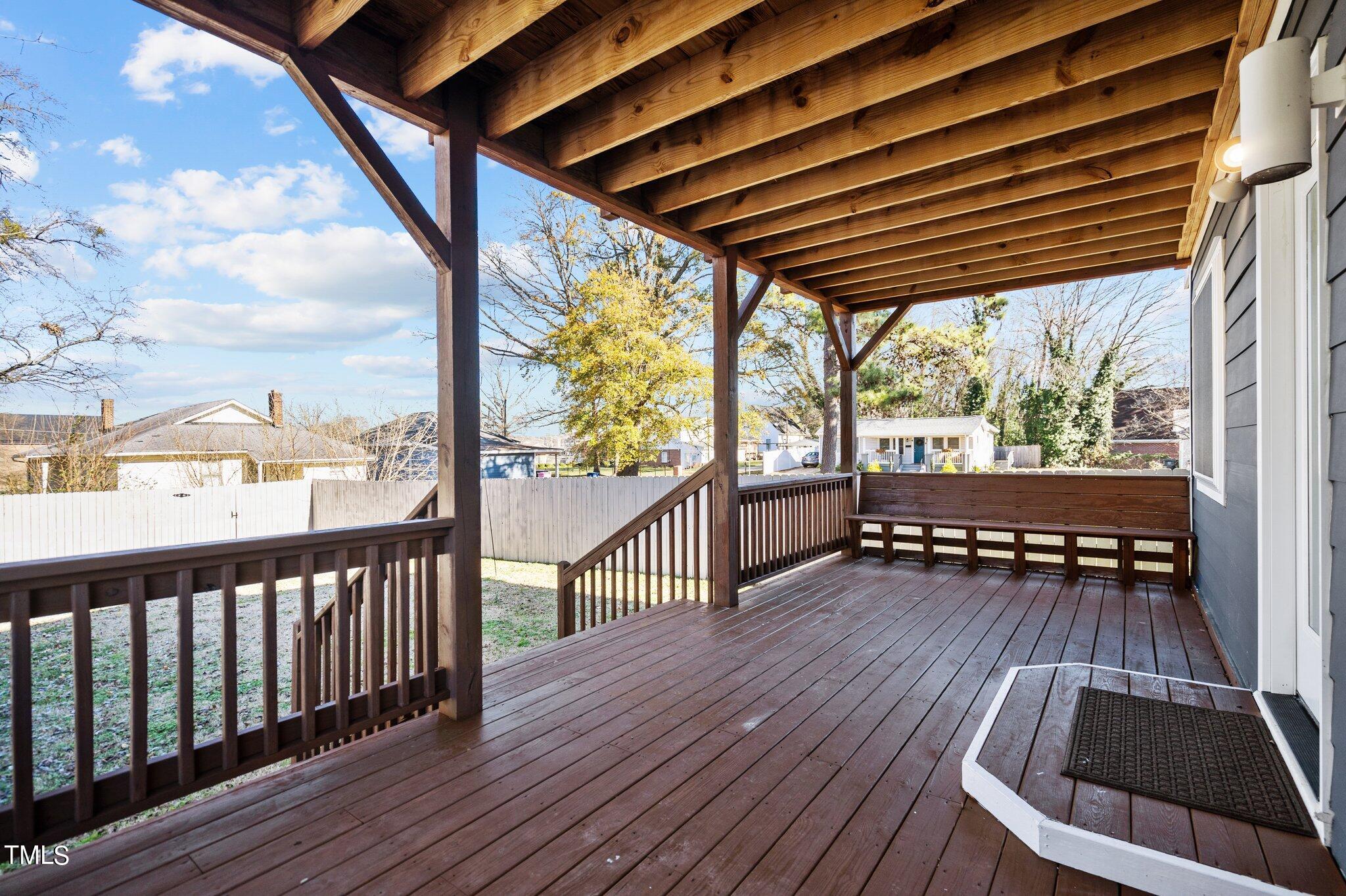 1427 East Lane Street Raleigh, NC 27610 - Photo 36 of 53 a view of deck with wooden floor and outdoor seating