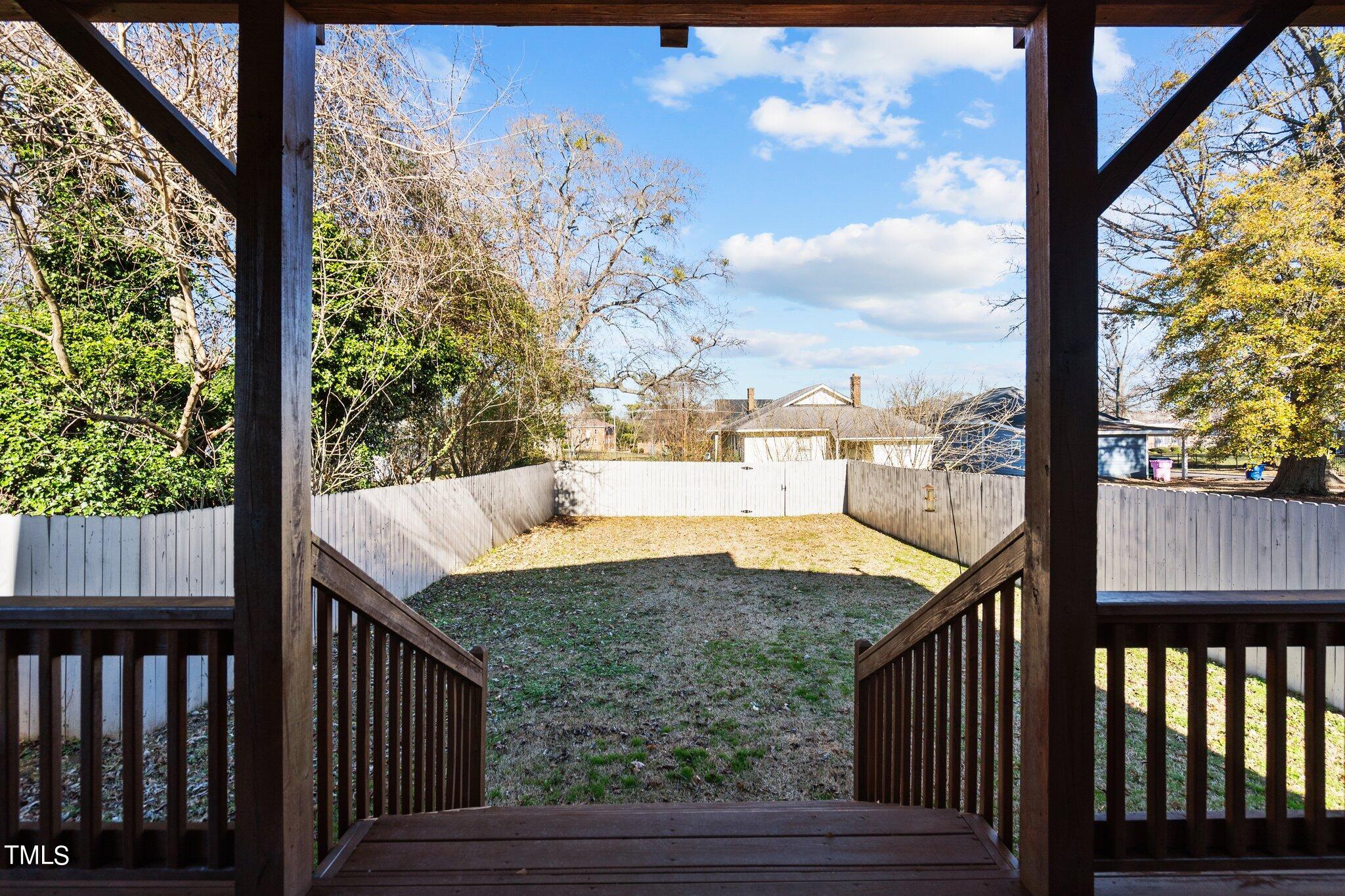 1427 East Lane Street Raleigh, NC 27610 - Photo 39 of 53 a view of a balcony with mountain view and wooden floor