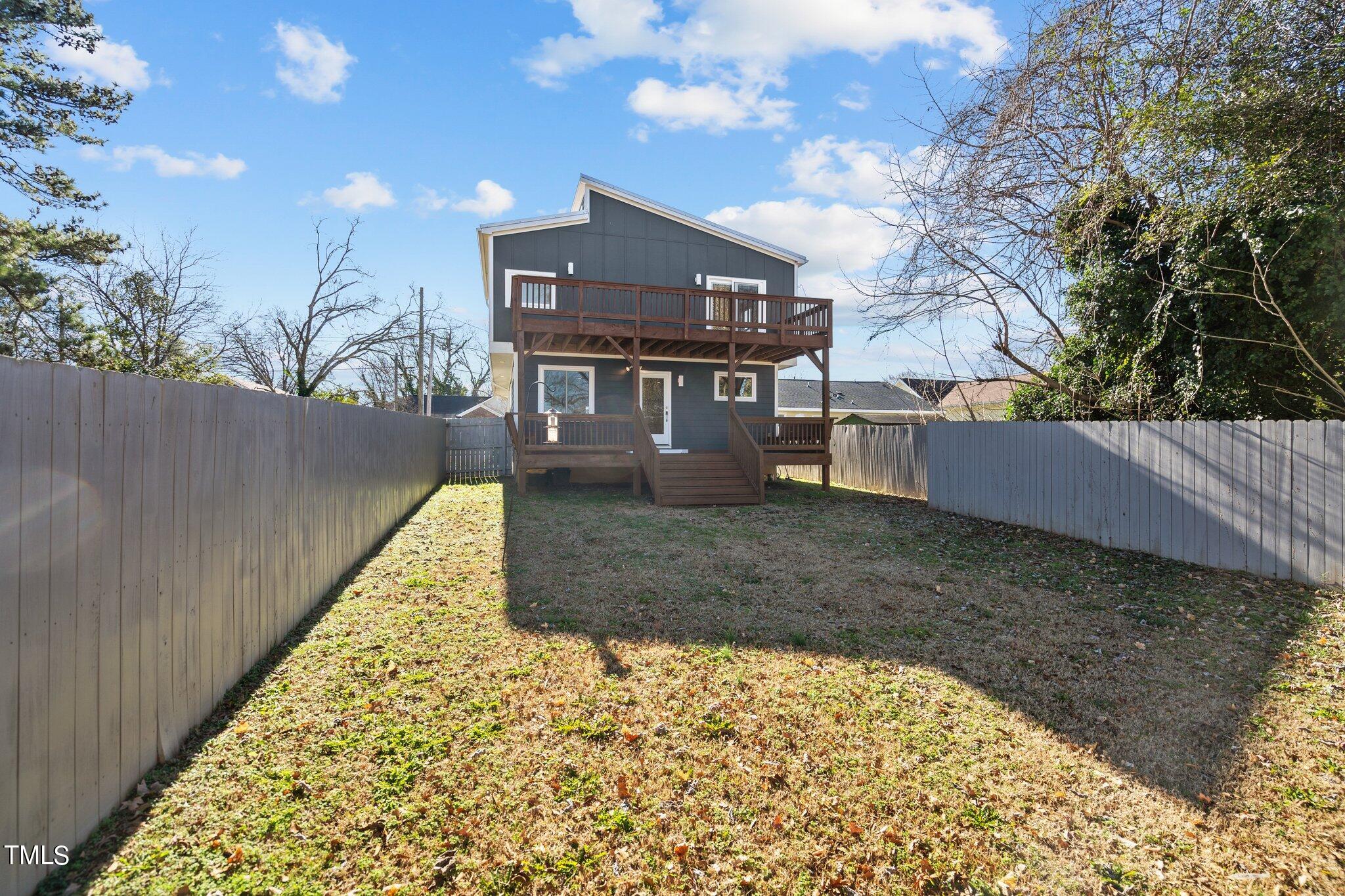 1427 East Lane Street Raleigh, NC 27610 - Photo 40 of 53 a view of a house with a yard