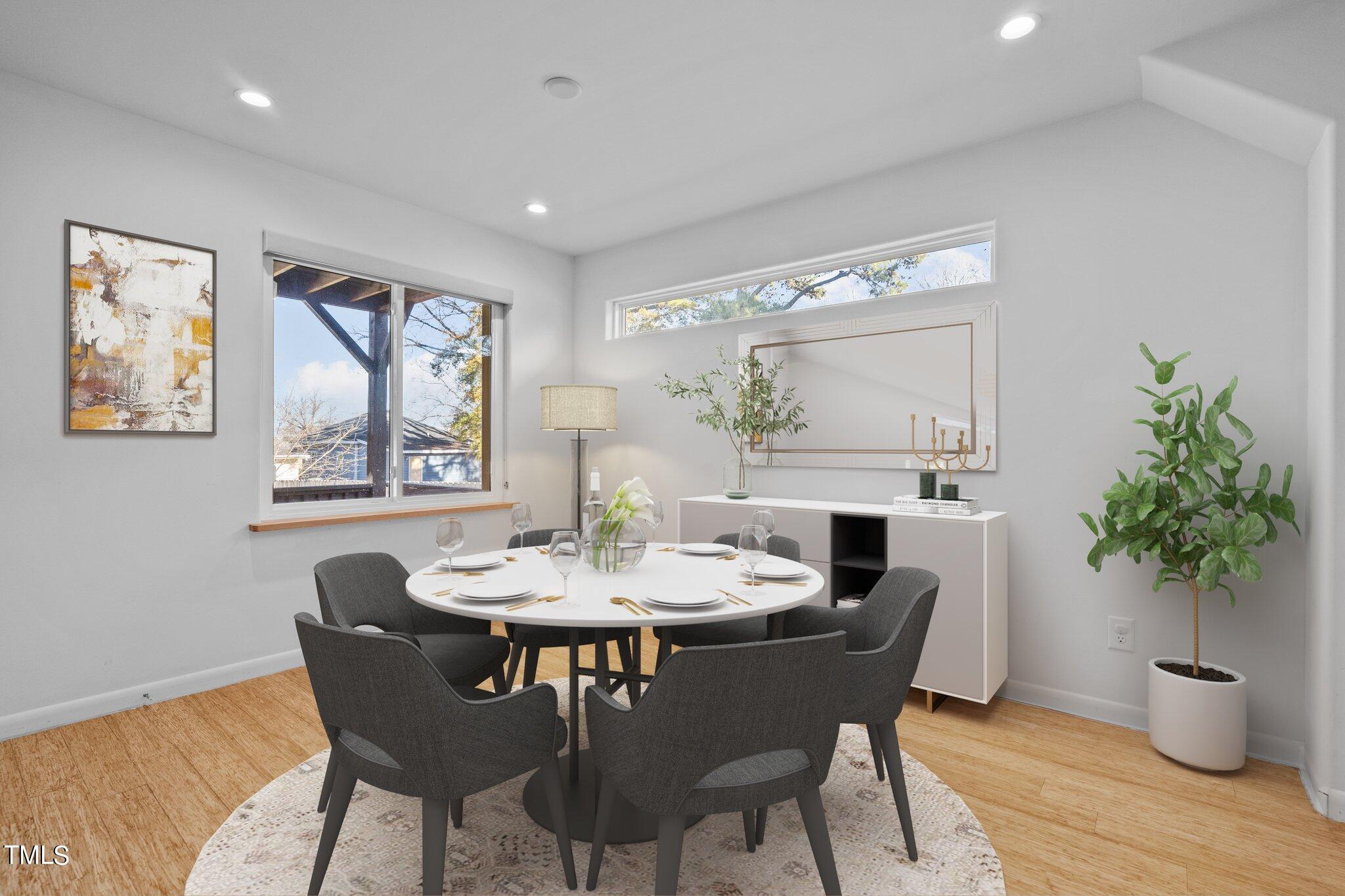 1427 East Lane Street Raleigh, NC 27610 - Photo 45 of 53 a view of a dining room with furniture window and wooden floor