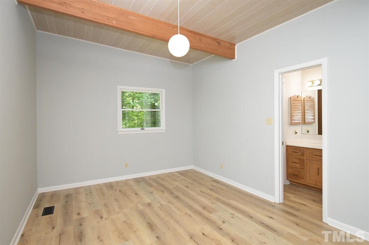 19 Learned Place Durham, NC 27705 - Photo 12 of 30 an empty room with wooden floor and windows