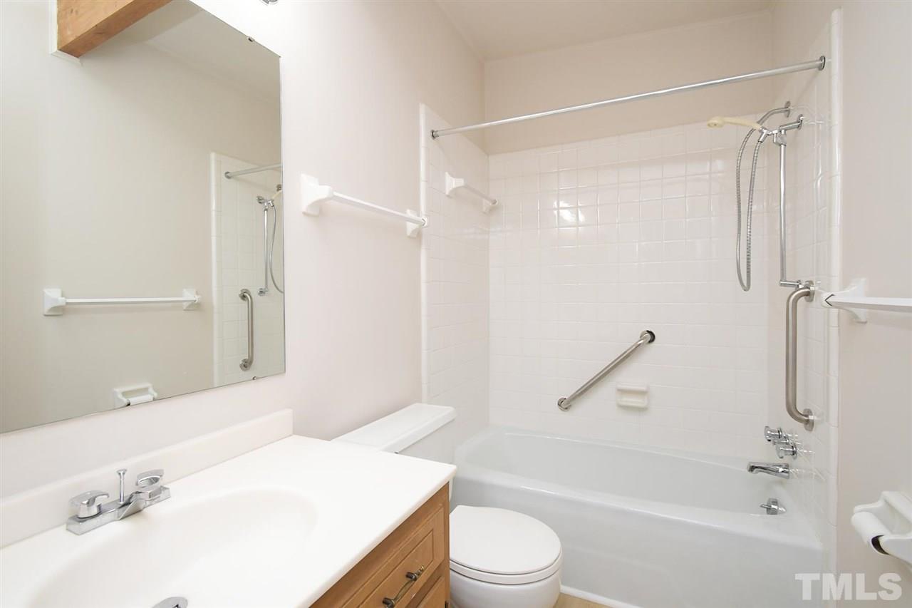 19 Learned Place Durham, NC 27705 - Photo 15 of 30 a bathroom with a bathtub shower sink vanity and toilet