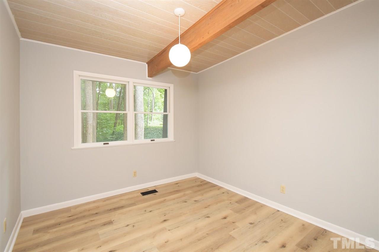 19 Learned Place Durham, NC 27705 - Photo 16 of 30 an empty room with wooden floor and windows