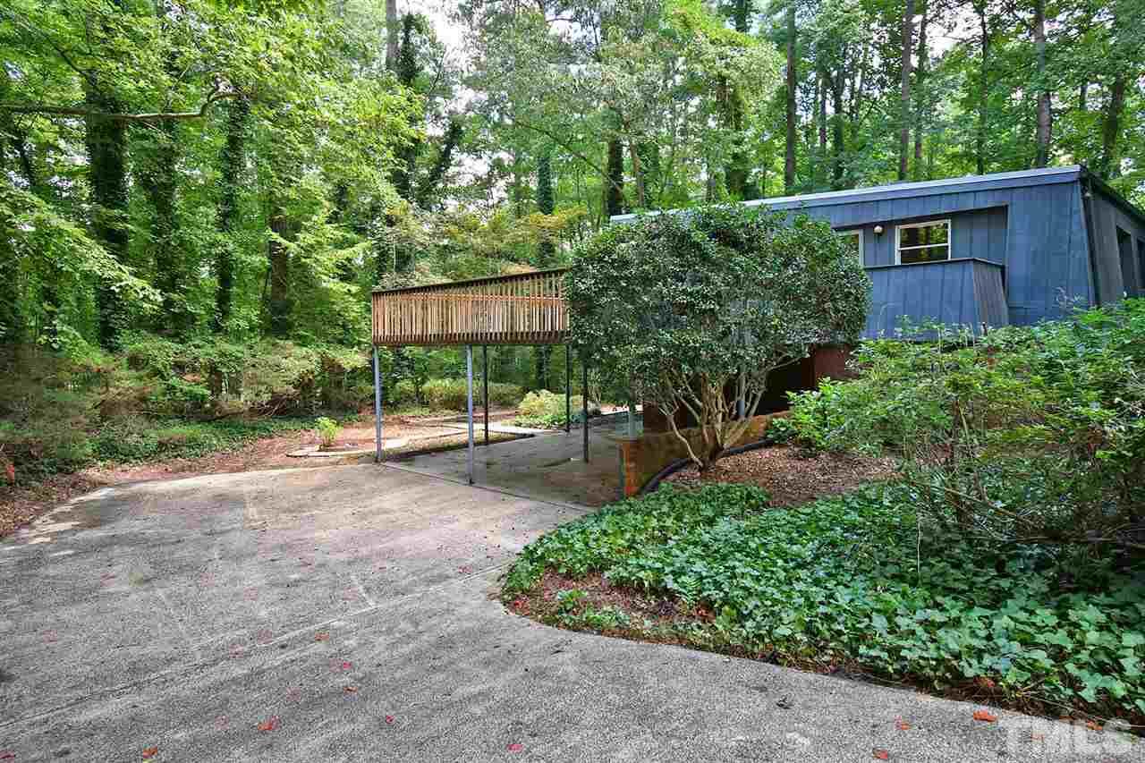19 Learned Place Durham, NC 27705 - Photo 24 of 30 a view of a backyard with potted plants and large trees