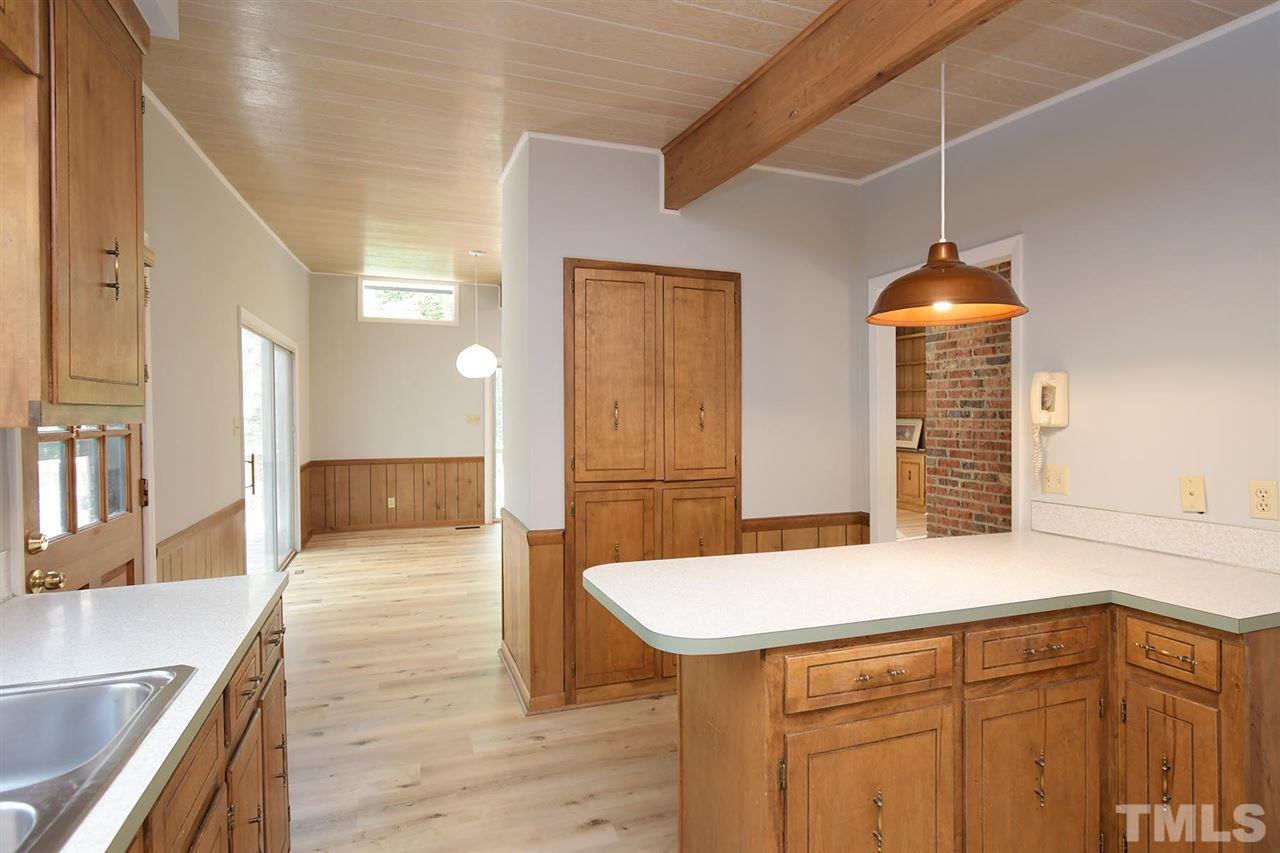 19 Learned Place Durham, NC 27705 - Photo 4 of 30 a kitchen with a sink cabinets and wooden floor