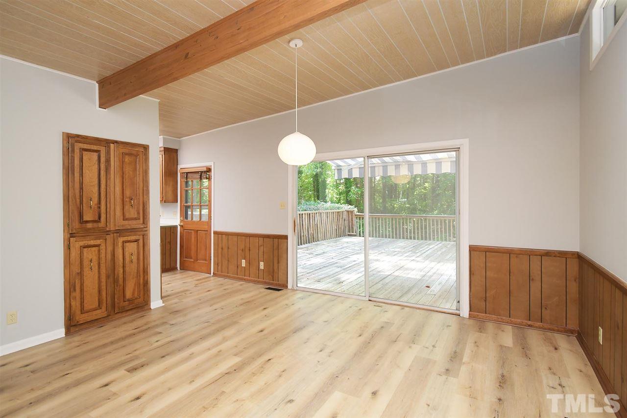 19 Learned Place Durham, NC 27705 - Photo 5 of 30 a view of empty room with wooden floor and fan