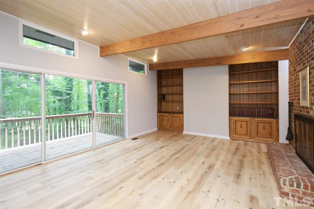 19 Learned Place Durham, NC 27705 - Photo 8 of 30 a view of empty room with wooden floor and fan