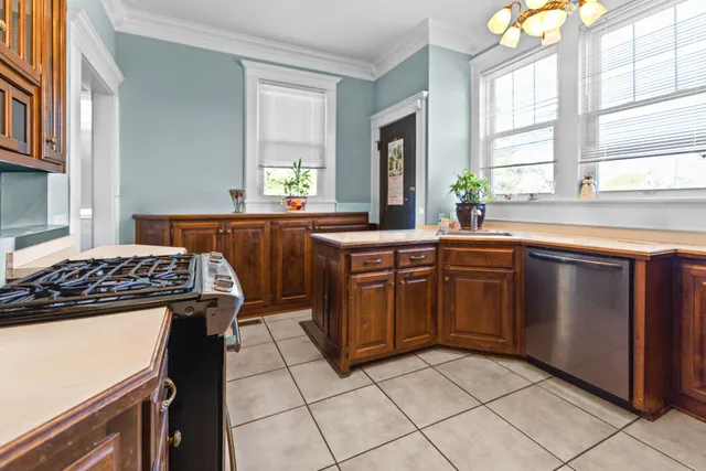 a kitchen with a refrigerator and a sink