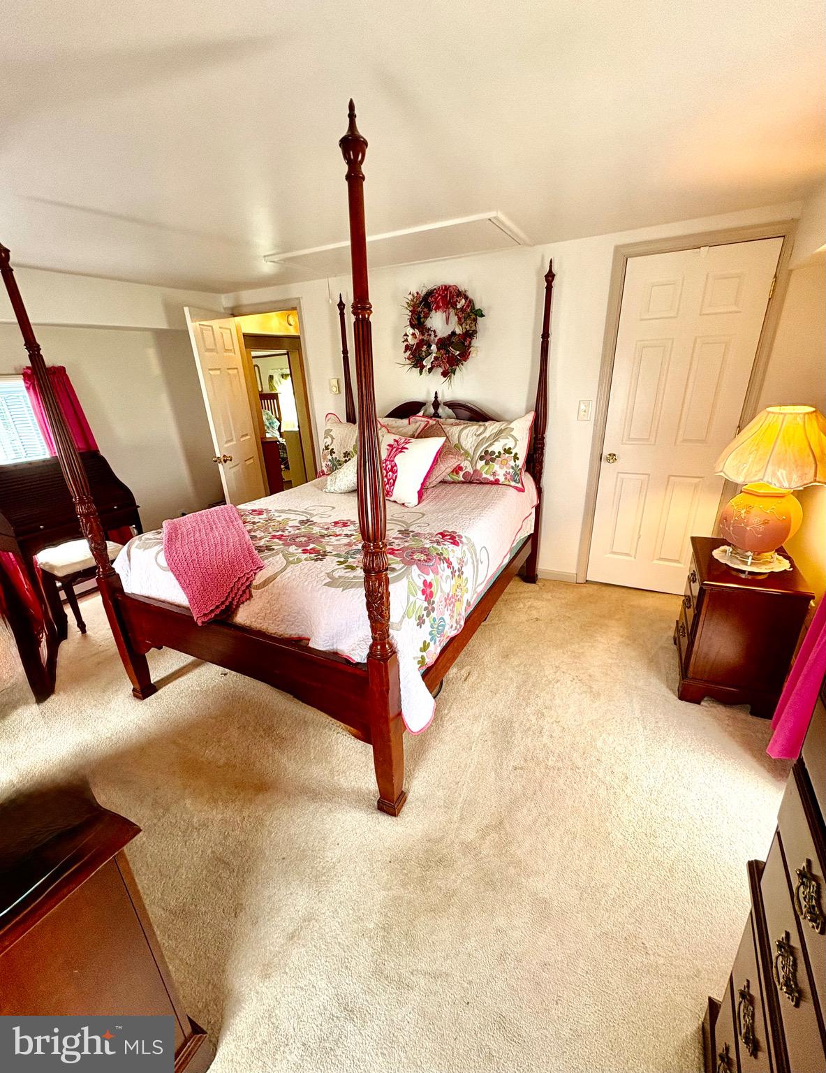 3411 Marsh Road Ewell, MD 21824 - Photo 17 of 24 a bedroom with a bed and wooden floor