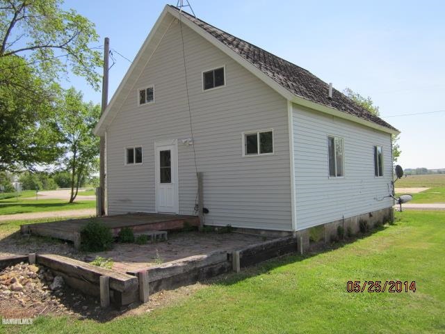 16583 Argo Fay Route Thomson, IL 61285 - Photo 18 of 18 a view of a white house with yard and sitting area