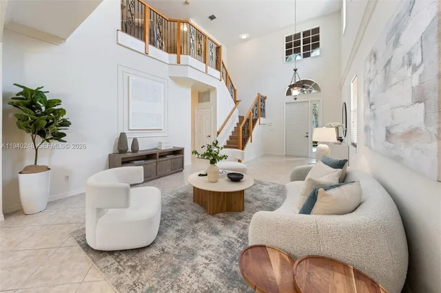 a living room with furniture and white walls