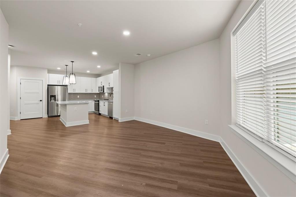 2648 Sandy Plains Road, Unit 420 Marietta, GA 30062 - Photo 12 of 37 a view of kitchen view with wooden floor and cabinets