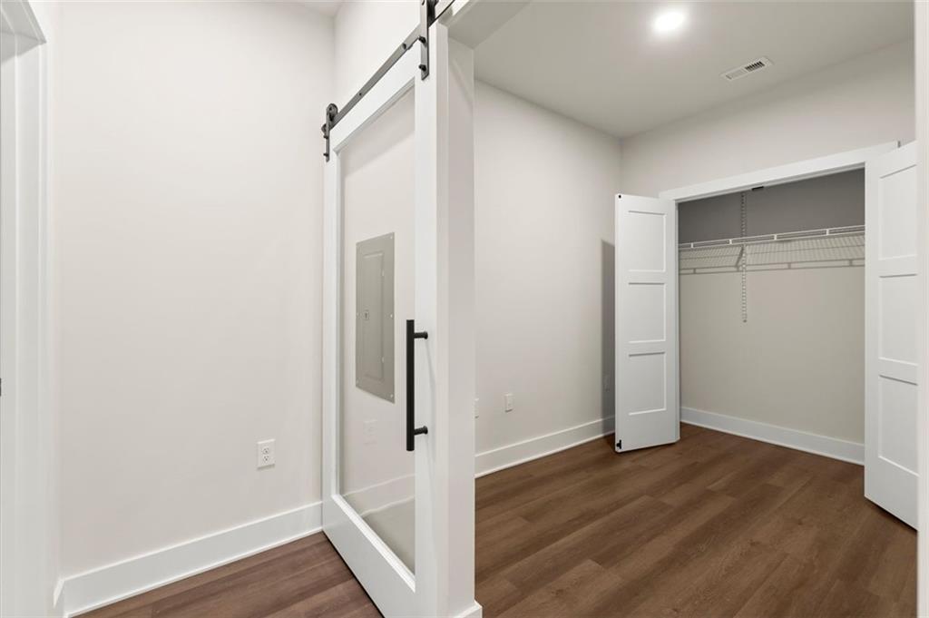 2648 Sandy Plains Road, Unit 420 Marietta, GA 30062 - Photo 13 of 37 a view of a hallway with wooden floor