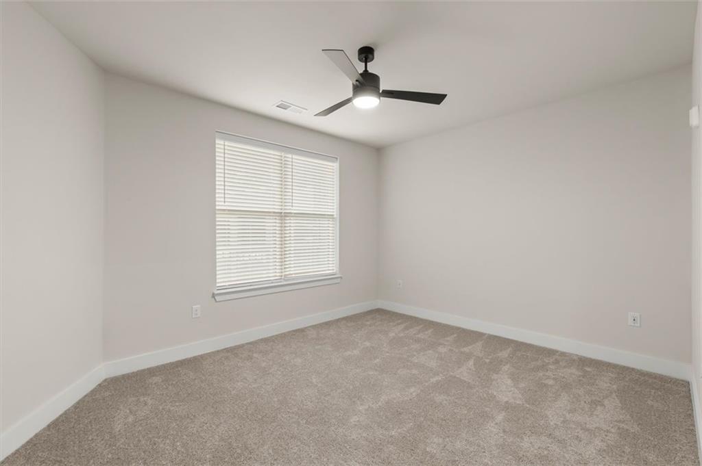 2648 Sandy Plains Road, Unit 420 Marietta, GA 30062 - Photo 17 of 37 an empty room with a window