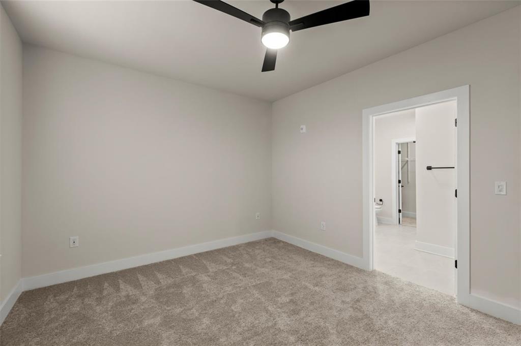 2648 Sandy Plains Road, Unit 420 Marietta, GA 30062 - Photo 19 of 37 an empty room with closet and windows