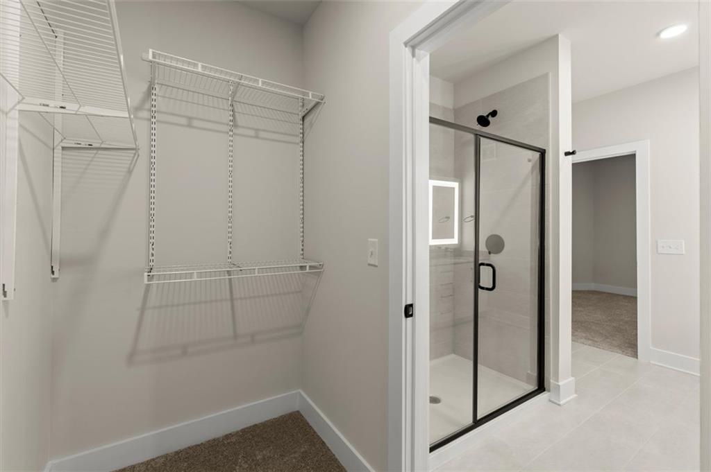2648 Sandy Plains Road, Unit 420 Marietta, GA 30062 - Photo 22 of 37 a bathroom with a shower