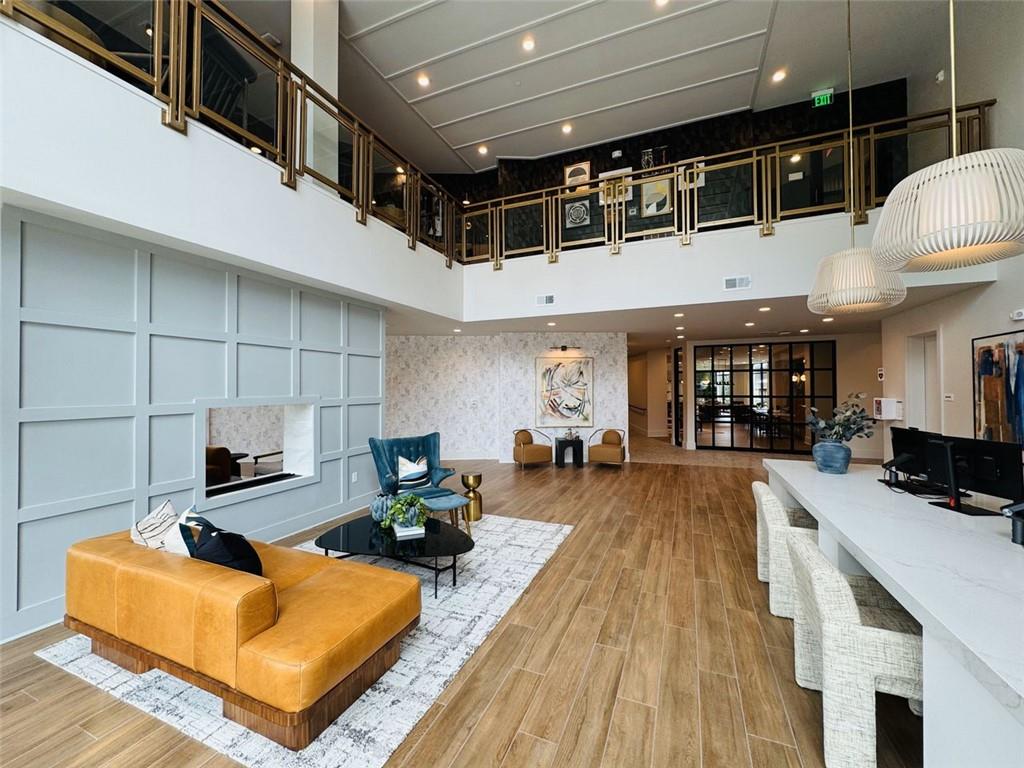 2648 Sandy Plains Road, Unit 420 Marietta, GA 30062 - Photo 28 of 37 a living room with fireplace furniture and a wooden floor