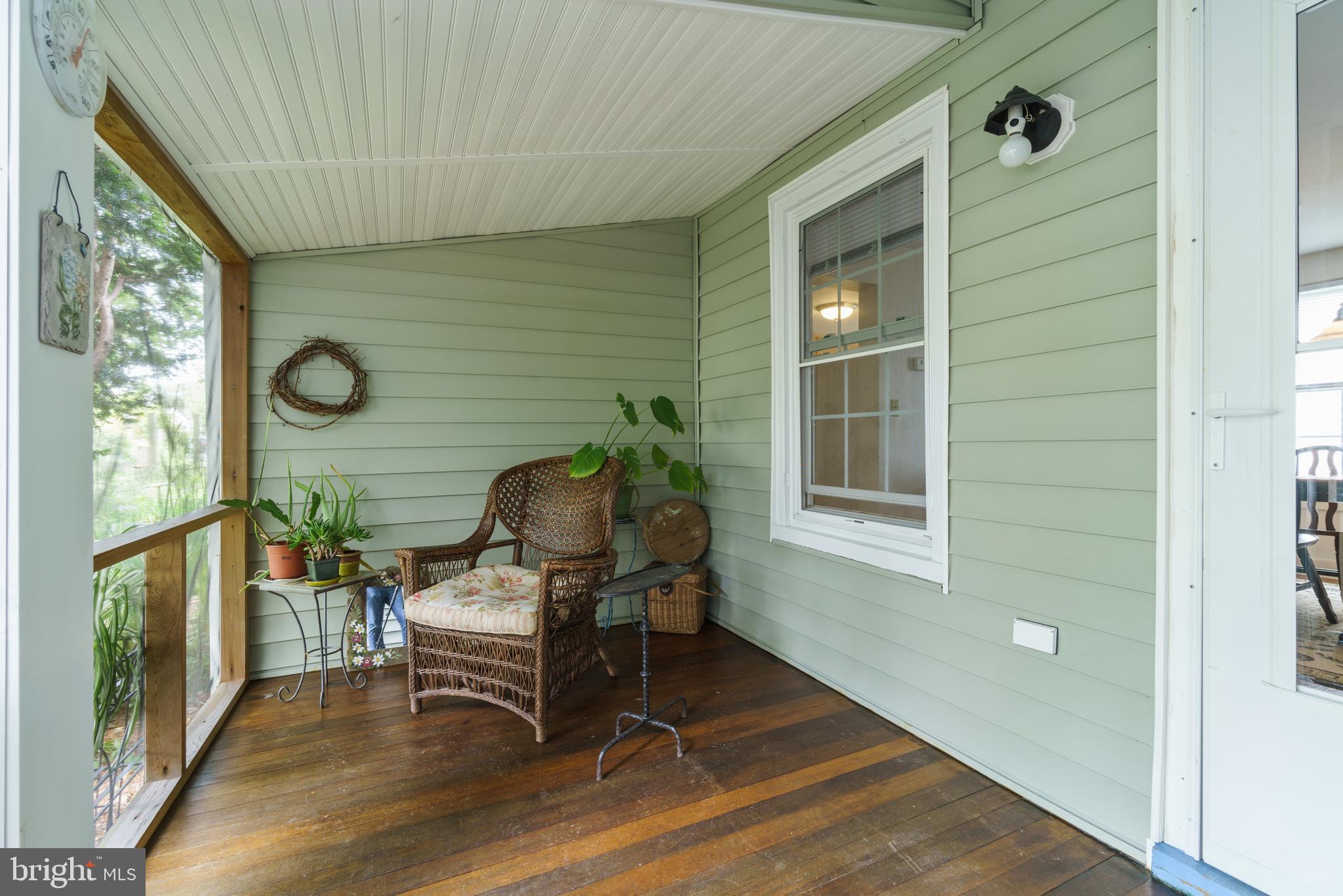 211 Central Ridgely, MD 21660 - Photo 30 of 44 Side porch with Mahogany wood floors