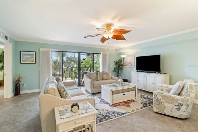 a dining room filled a chandelier a table and chairs