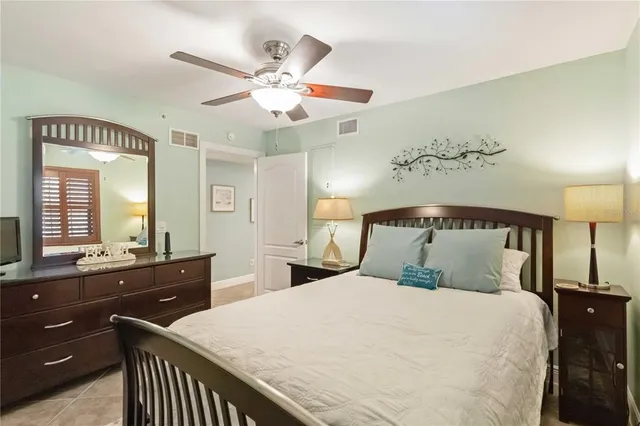 a bathroom with a toilet and a shower curtain