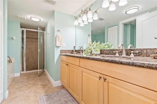 a view of swimming pool with outdoor seating and plants