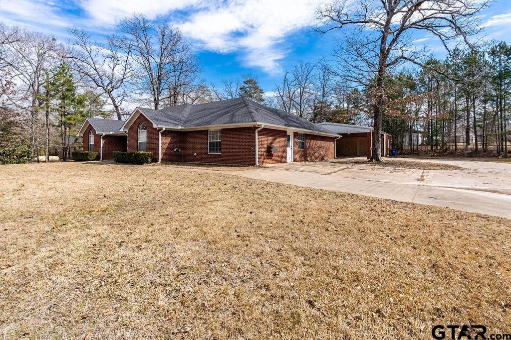 360 Anderson County Road Palestine, TX 75803 - Photo 11 of 41 a front view of a house with a yard and garage